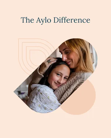 Mother and daughter hugging encapsulated within the stylized Aylo mark