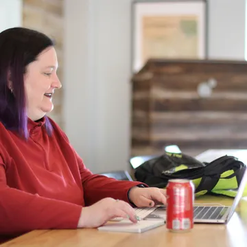 Senior User Experience Designer Melissa Foley at a laptop